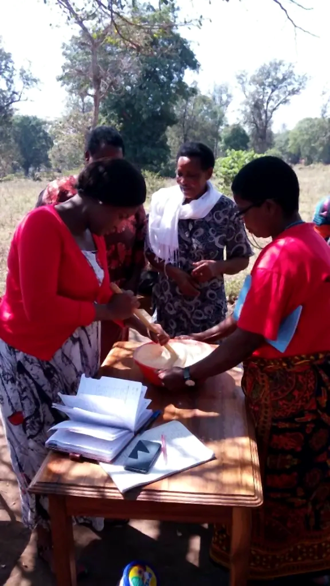 Community outreach activity around an outdoor table