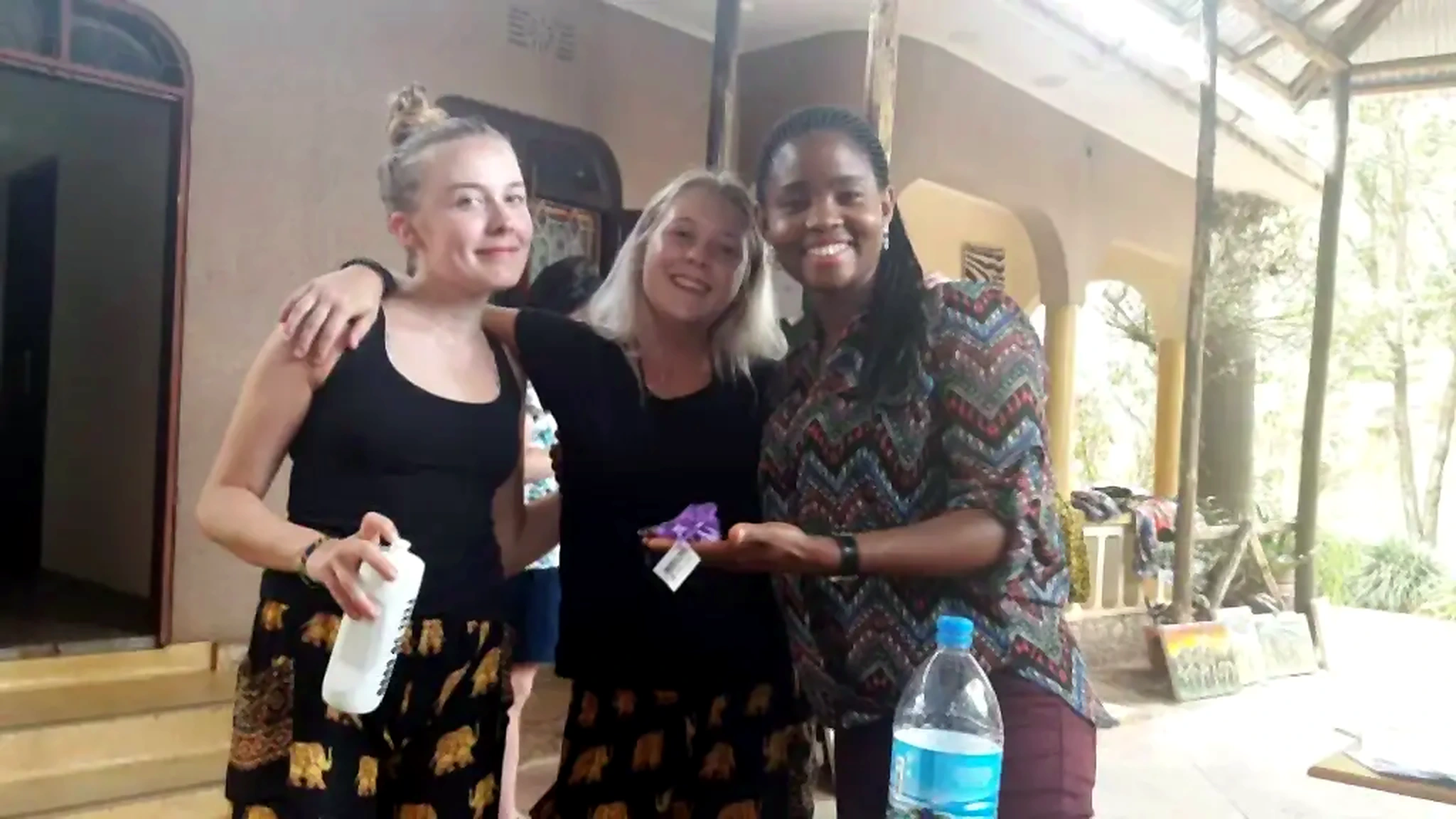 Outreach Experience Foundation volunteers and community members standing together in Tanzania