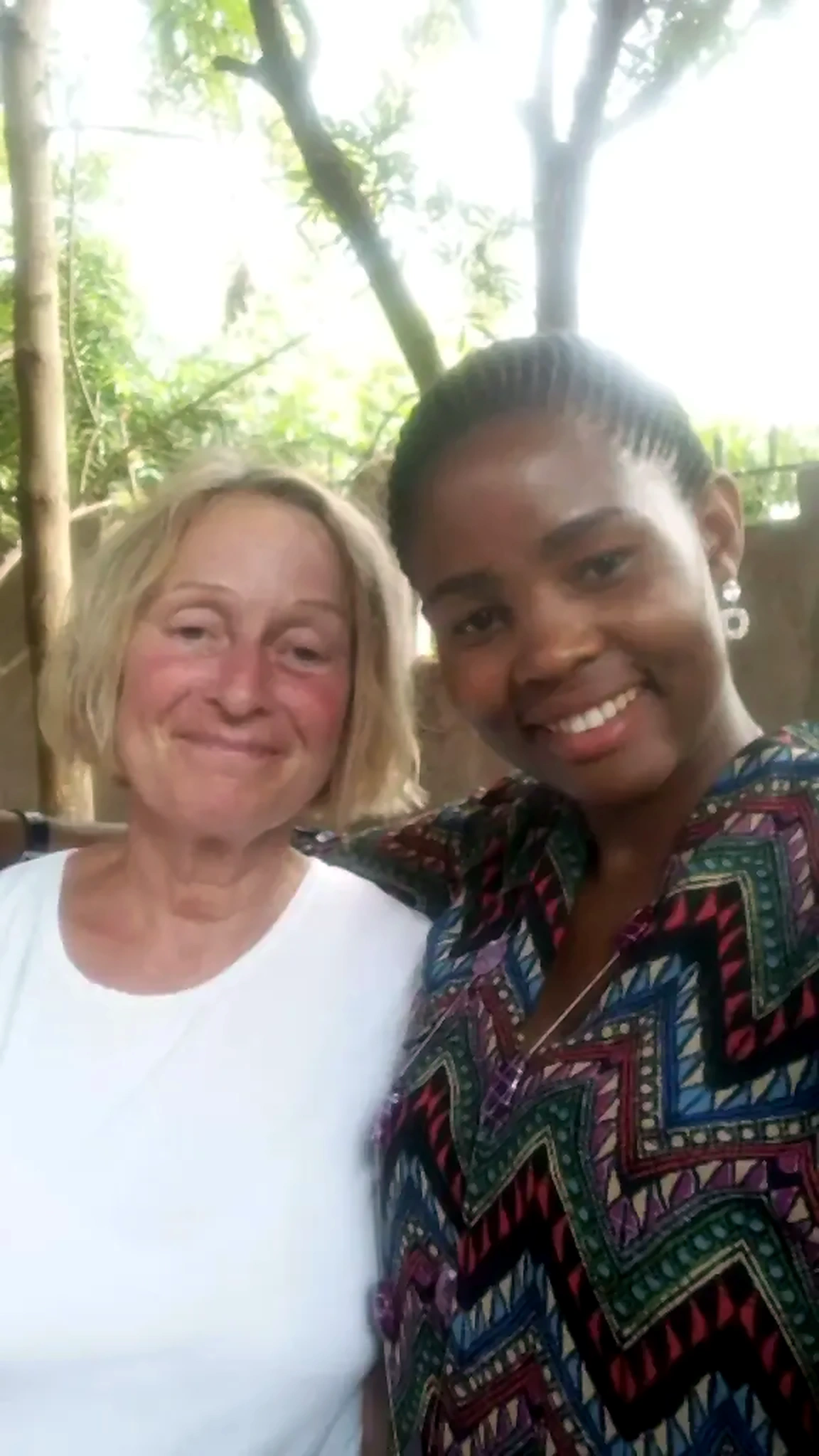 Two Outreach Experience Foundation volunteers outdoors